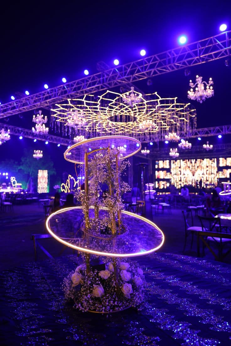 Formal event setup with tables and floral centerpieces